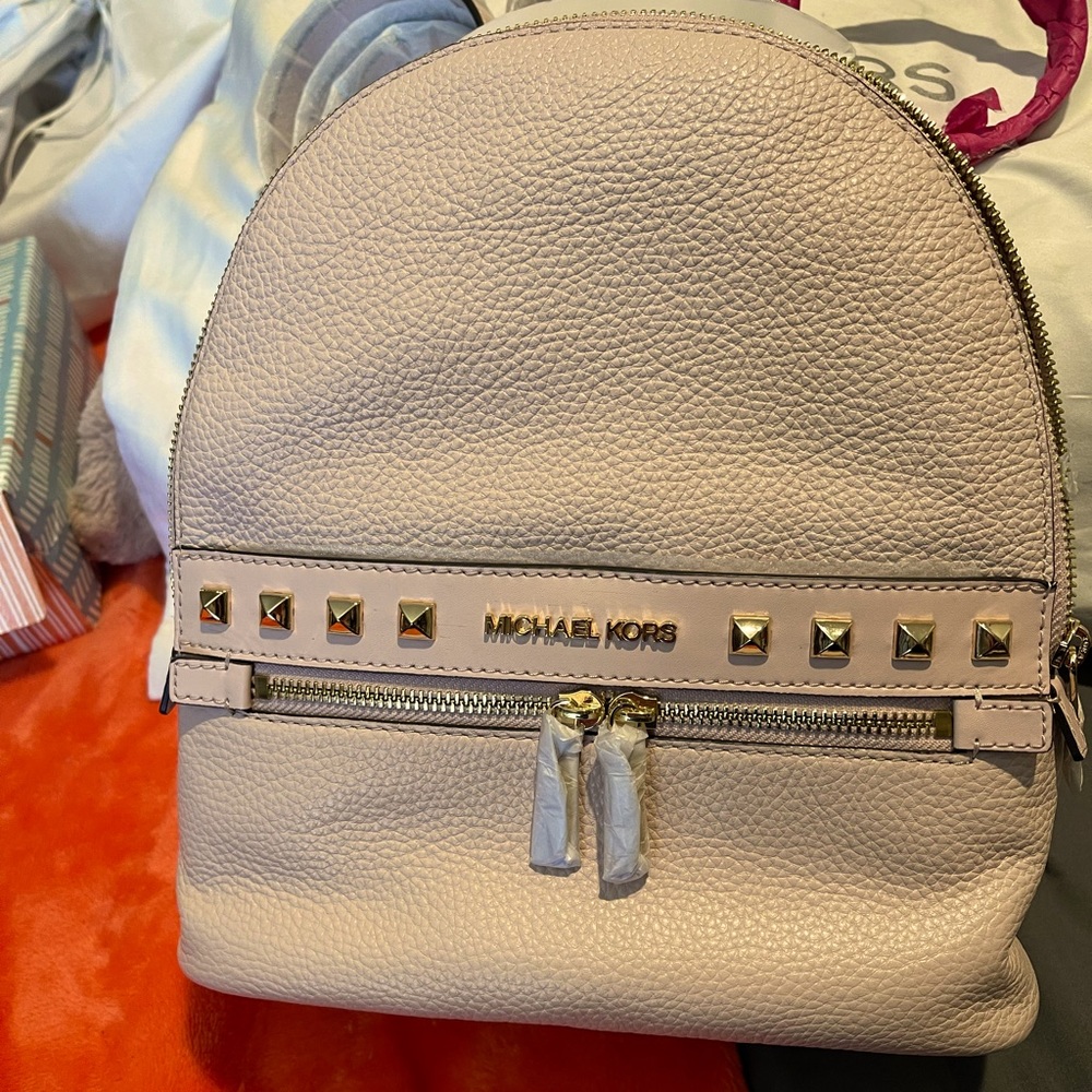 Micheal Kors Rhea pebbled leather studded back pack with matching wallet